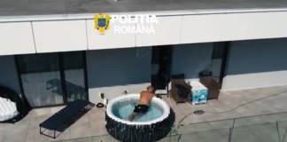 VIDEO Un urmărit internațional pentru trafic de droguri a fost găsit relaxându-se într-un jacuzzi pe terasa unui bloc din Bistrița