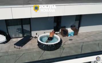 VIDEO Un urmărit internațional pentru trafic de droguri a fost găsit relaxându-se într-un jacuzzi pe terasa unui bloc din Bistrița
